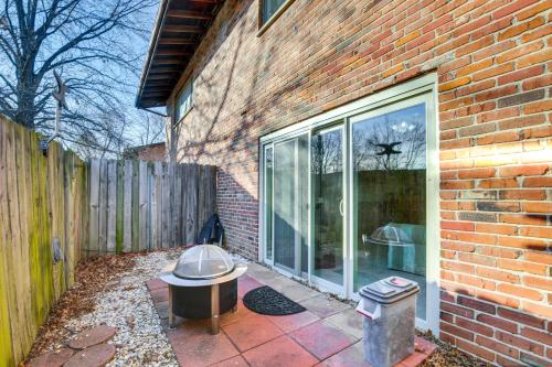 a patio with a toilet next to a brick building at St Ann Townhome Less Than 1 Mi to International Airport! in Edmundson