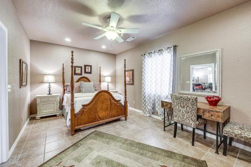 a bedroom with a bed and a desk and a fan at Pet-Friendly Dover Cottage w/ Deck + Mtn Views! in Dover