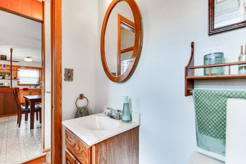 a bathroom with a sink and a mirror at Milwaukee Home with Fire Pit about 8 Mi to Lake Michigan in Milwaukee