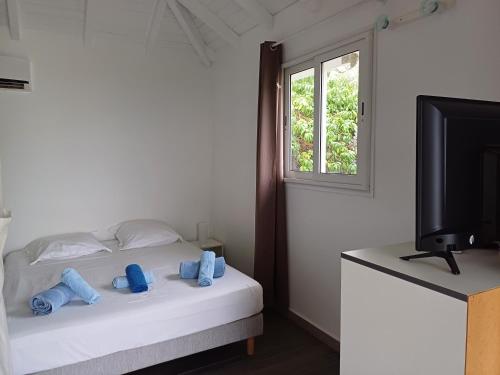 Postel nebo postele na pokoji v ubytování B. O. PARADIS SXM