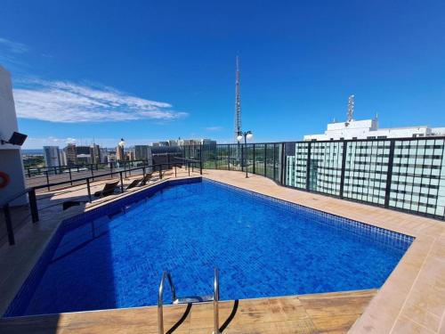 a large swimming pool on top of a building at Lets Idea Brasilia Hotel - Flat Particular in Brasília