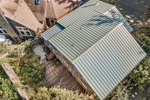 an overhead view of a house with a white roof at Comfy Cabin by the Sea in Nehalem