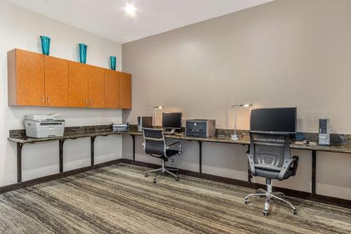 an office with two desks with chairs and computers at Best Western Airport Inn & Suites in Charleston