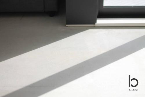 a shadow of a door and a window in a room at b hotel Heiwaodori 601 - New Apt In Famous Hiroshima Dori For 6p in Hiroshima