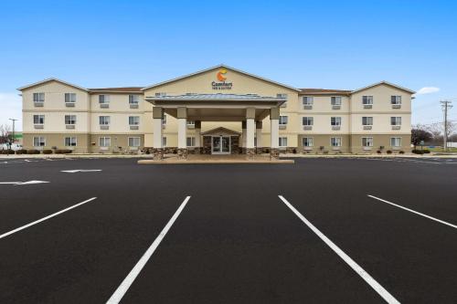 an empty parking lot in front of a hotel at Comfort Inn & Suites in Fremont