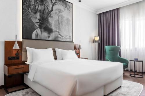Кровать или кровати в номере Radisson Blu Hotel, Tashkent