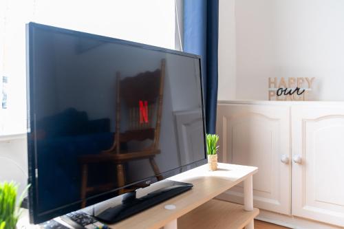 a large flat screen tv sitting on a table at Liverpool City Haven-Dane Street in Liverpool