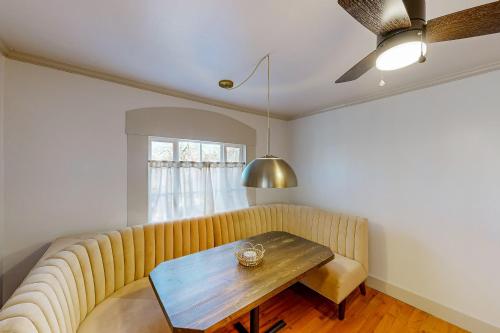 a living room with a couch and a table at The Lakeway House in Buford