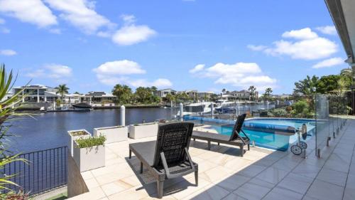 a balcony with a view of a body of water at Bribie Bliss: Luxe Canal Living in Banksia Beach