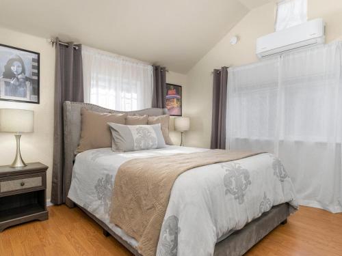 a bedroom with a large bed and a window at Reno Studio Gem: Cozy Netflix Free Parking in Reno