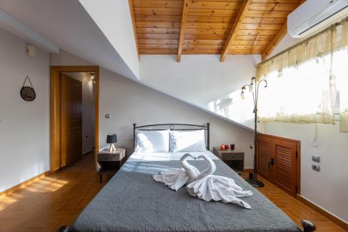 Katil atau katil-katil dalam bilik di Pavlos Apartments