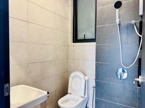 a bathroom with a toilet and a sink at New Urban Suite Majestics 3BR Homestay at Georgetown BY URBAN STAYCATION HENG LOD in Jelutong