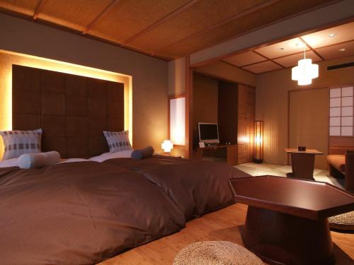 Letto o letti in una camera di Kinugawa Plaza Hotel