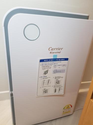 a white refrigerator with a sticker on it at Number 25 Hotel in Gwangju