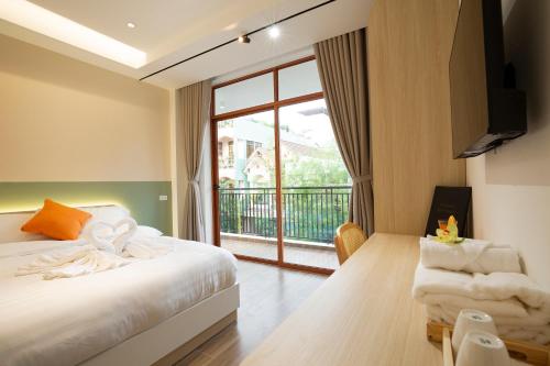 Postel nebo postele na pokoji v ubytování Sonder Homestay Quy Nhon