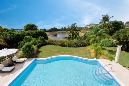 an overhead view of a swimming pool in a garden at Royal Westmoreland - Ocean Drive 8 villa in Saint James