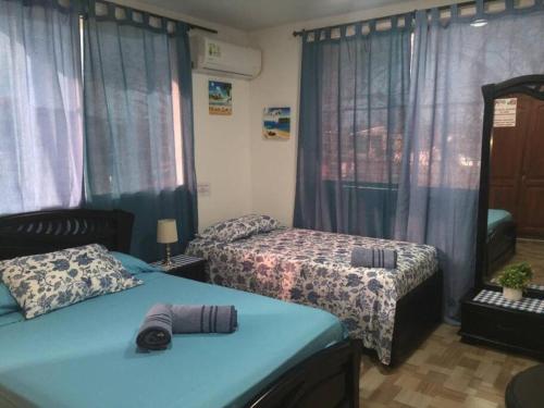 Ένα ή περισσότερα κρεβάτια σε δωμάτιο στο Casa Turistica Dónde MATHY'S #1 Barrio Sarie Bay