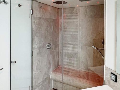 a shower with a glass door in a bathroom at Apartment Wendtorf XI in Wendtorf