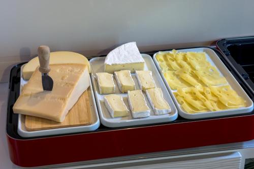 a lunch box with cheese and other food items at Hotel Cortaccia Sanvitale in Sala Baganza