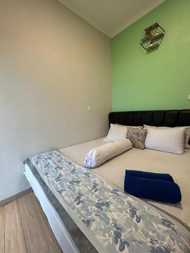 a bedroom with two beds in a room at Clamitan House in Padalarang