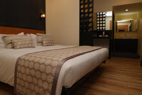 Postel nebo postele na pokoji v ubytování HOTEL SR