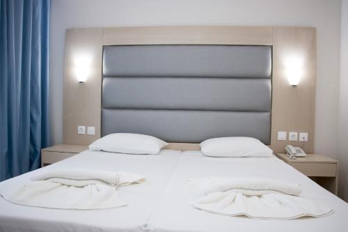 Ένα ή περισσότερα κρεβάτια σε δωμάτιο στο Marathon Hotel - All Inclusive