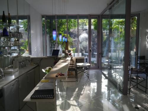 a kitchen with a counter and a large window at Pallazzo Alfonso in Aachen