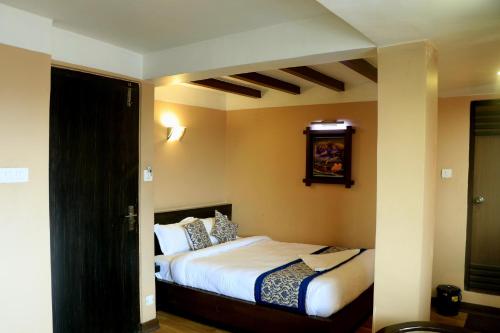 Postel nebo postele na pokoji v ubytování Hotel Garuda