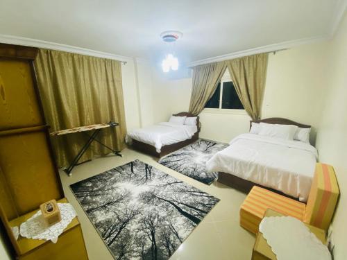 Postel nebo postele na pokoji v ubytování كورنيش النيل البحر الاعظم -Nile corniche albahr alaeizam