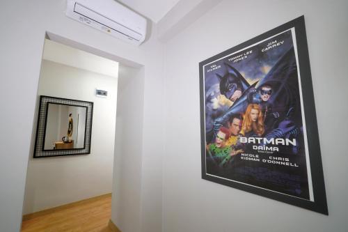 a poster for batman returns on a wall in a room at Meet İstanbul Hotel Kadikoy in Istanbul