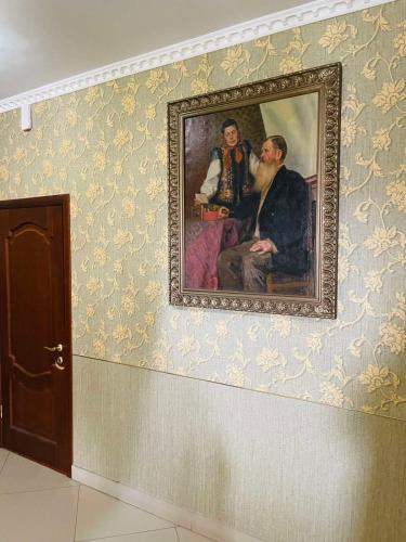 a painting of a man and a woman on a wall at ГОК Віват in Morshin
