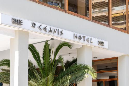 a sign for the kennedy hotel in front of a building at Oceanis Hotel in Kavala