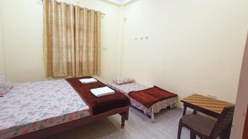 Voodi või voodid majutusasutuse ARJUN PAYING GUEST HOUSE toas