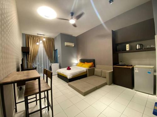 a room with a bed and a table and a kitchen at 5mins to Sunway #Subang SS15 Stylish Studio #3pax in Subang Jaya