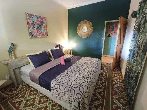 a bedroom with a large bed in a room at Quinta Pereiro Tropic Garden, Algarve in Moncarapacho