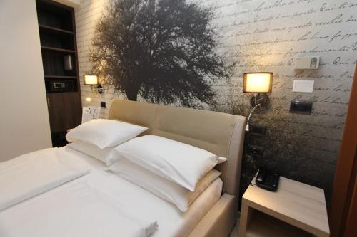 Postel nebo postele na pokoji v ubytování Hotel Villa Rosa