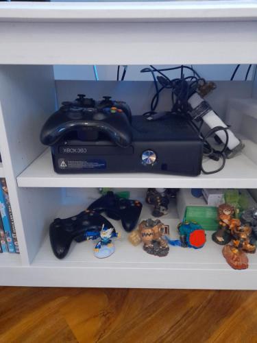 a shelf with a camera and toys on it at Glastonbury town center-entire apartment in Glastonbury
