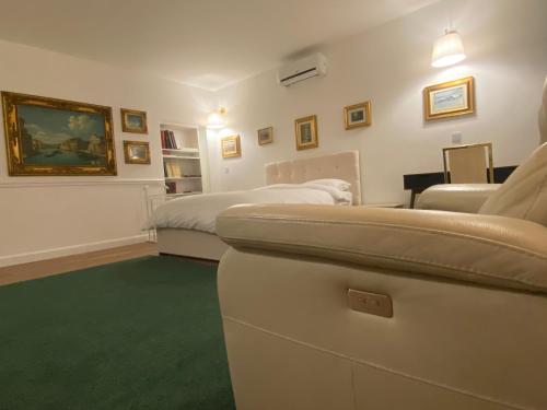 a hotel room with a bed and a couch at SAVANY B&Apartments in Buscate