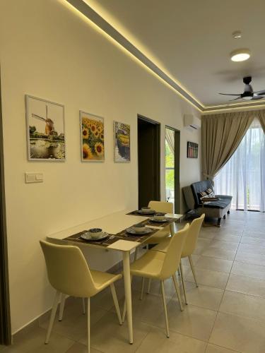 a dining room with a table and chairs at Sandakan Blue Coastal escape 蓝海岩栖 in Sandakan