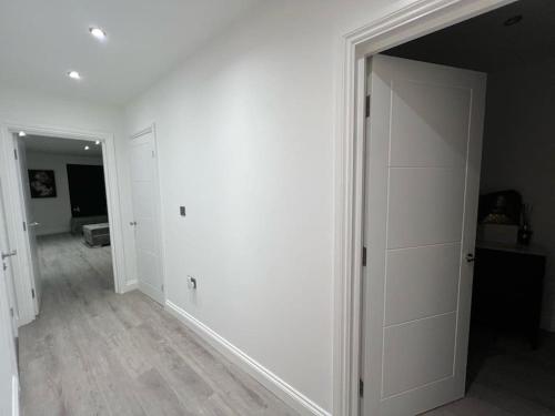 an empty room with white walls and a door at Monthly Discounts - Contractors - Business in Brentwood