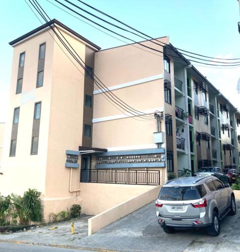 a car parked in front of a building at Deca homes condominium tisa Labangon in Cebu City