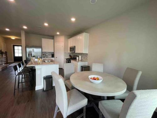 a kitchen and living room with a table and chairs at Spacious and fully equipped family house for 10 in Shenandoah