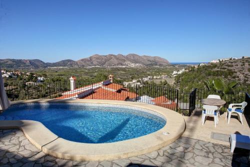 a swimming pool with a view of the mountains at Casa Miranda in Orba