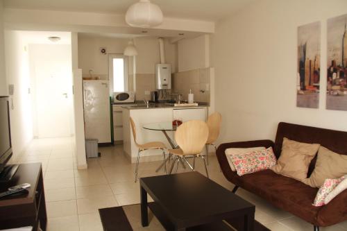 a living room with a couch and a table at Cordoba Rent Centro Avellaneda in Cordoba