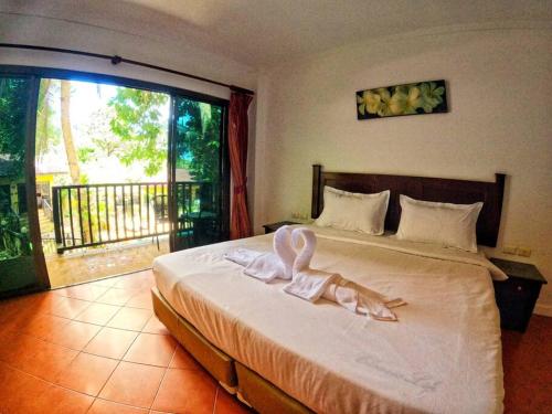 a bedroom with a bed with a bunny on it at beautiful pool house in Patong Beach