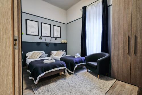 Un pat sau paturi într-o cameră la Double Rooms in zona Città Studi