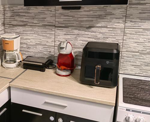 a kitchen with a coffee maker on a counter at Seagull center kavala in Kavála