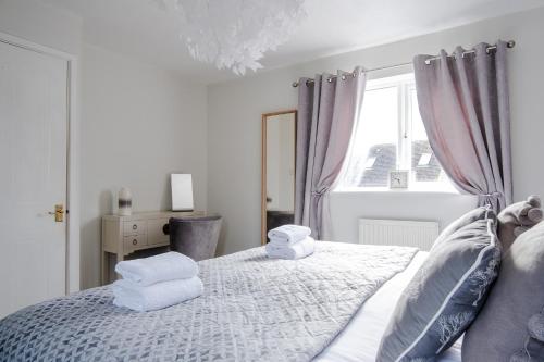 Letto o letti in una camera di Bibury House a lovely 2 bed house sleeps 4