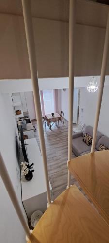 a view of a living room from the top of a house at SUITE BLANC APARTMENTS - Monolocali indipendenti con cucina e bagno privato - Check-in e check-out con codice in autonomia h24 - Terrazza in comune NECESSARIO AVERE WATHSAPP O APP DI MESSAGGISTICA ISTANTANEA PER FOTO E VIDEO in Guspini