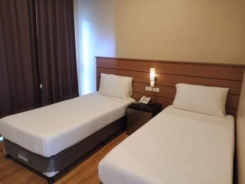 Кровать или кровати в номере Samal Sands and Shores